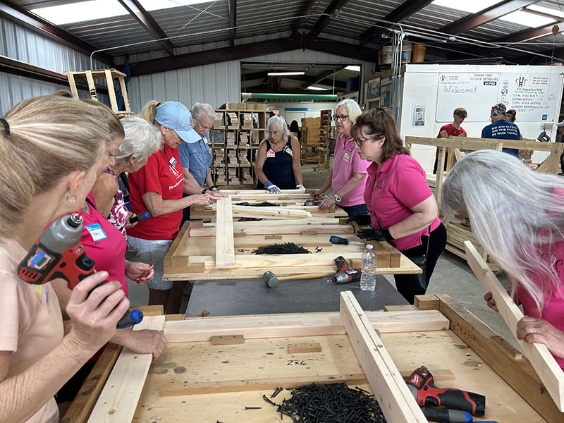 The Pink Ladies Help Build 50 Beds for Kids Sleeping on Floors