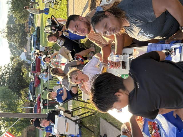 North Forest residents gathered around tables at the 2026 National Night Out